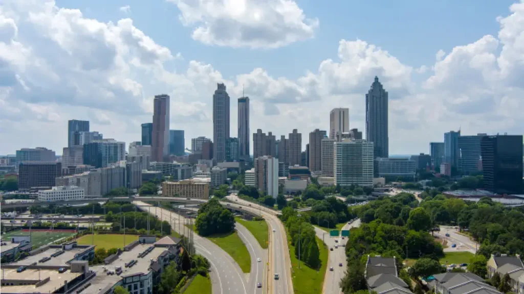 Atlanta skyline with highways, skyscrapers, greenery, and mesothelioma lawyer services available