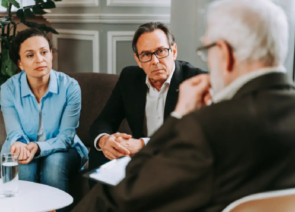 family discussing their case with a lawyer