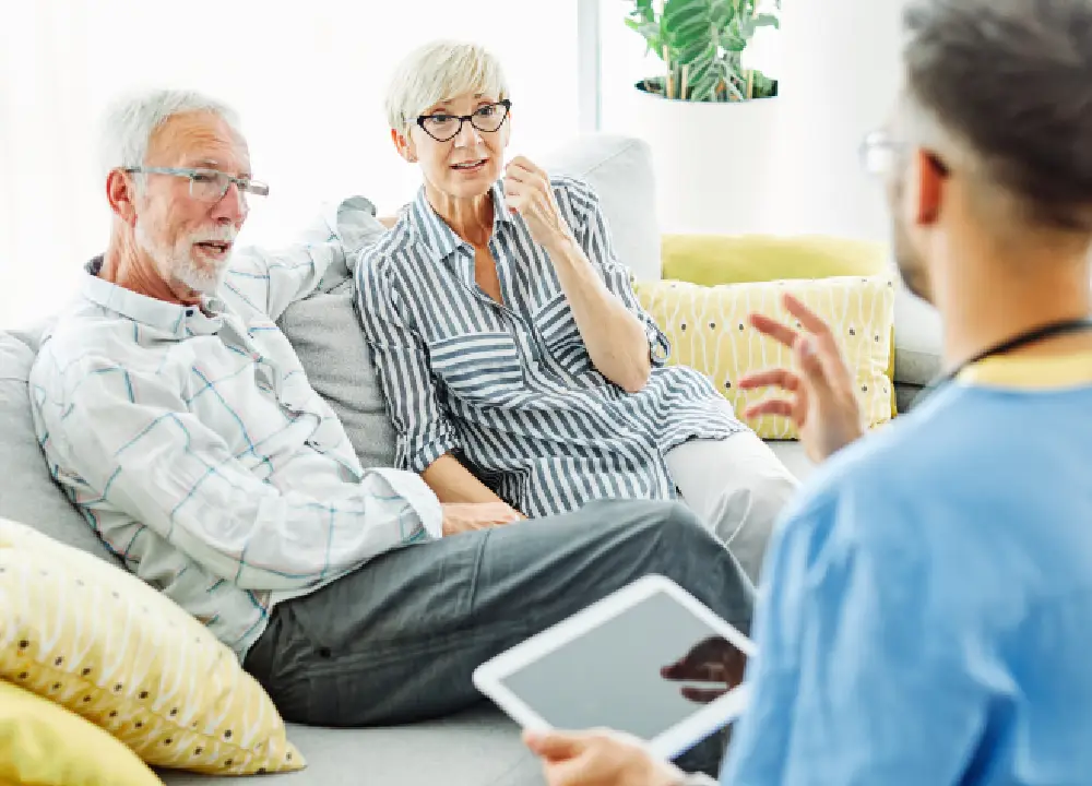 couple receiving a medical check-up from a doctor