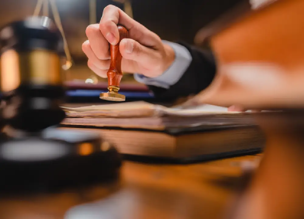 lawyer signing a legal document