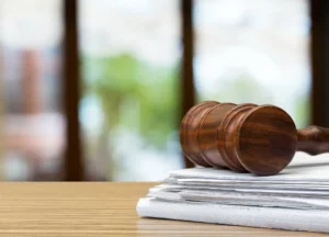 Judge's hammer on a wooden desk — symbolizing legal action for asbestos exposure victims.
