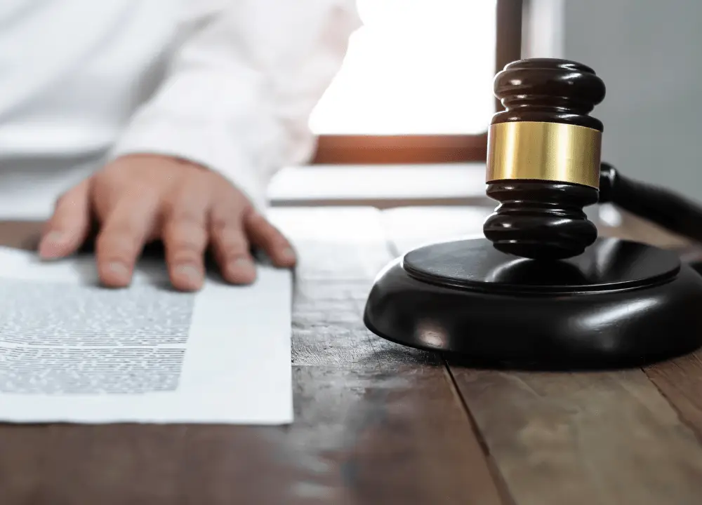 Owens-Illinois asbestos lawsuit legal concept with gavel and documents