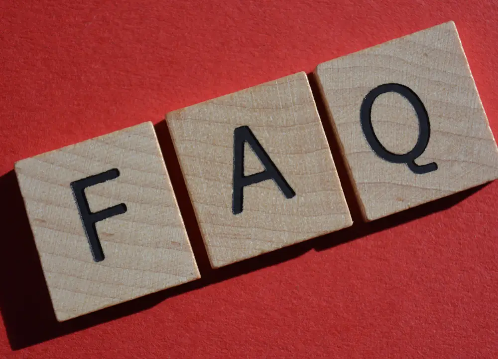 FAQ acronym displayed in bold white letters on a red background representing frequently asked questions.